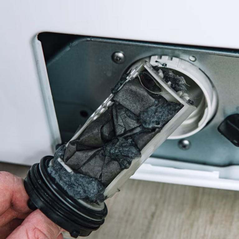 Cleaning a washing machine drain filter to prevent drainage problems